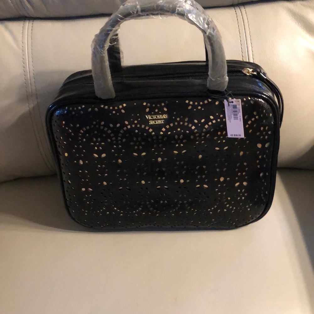 New!Black with Gold lining, a Victoria Secret traveling cosmetic bag!